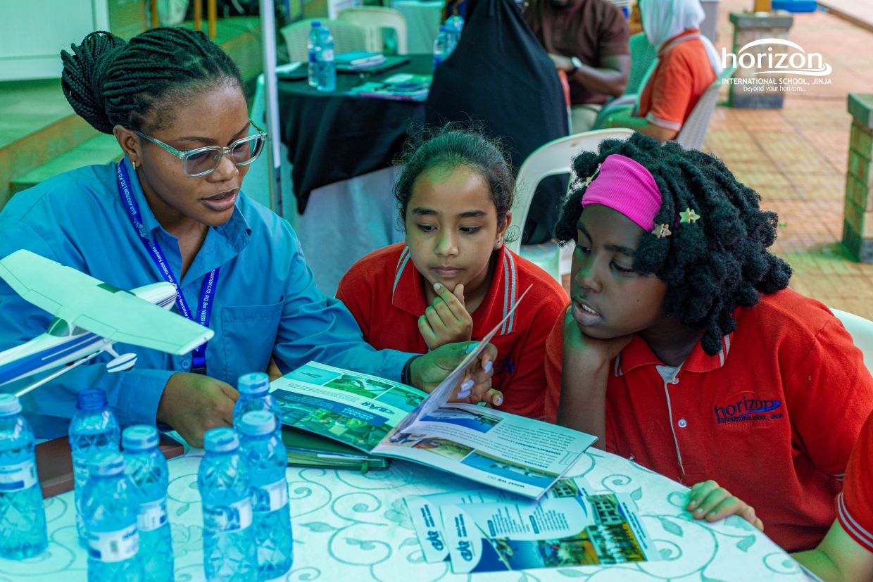 Students speaking with a university representative